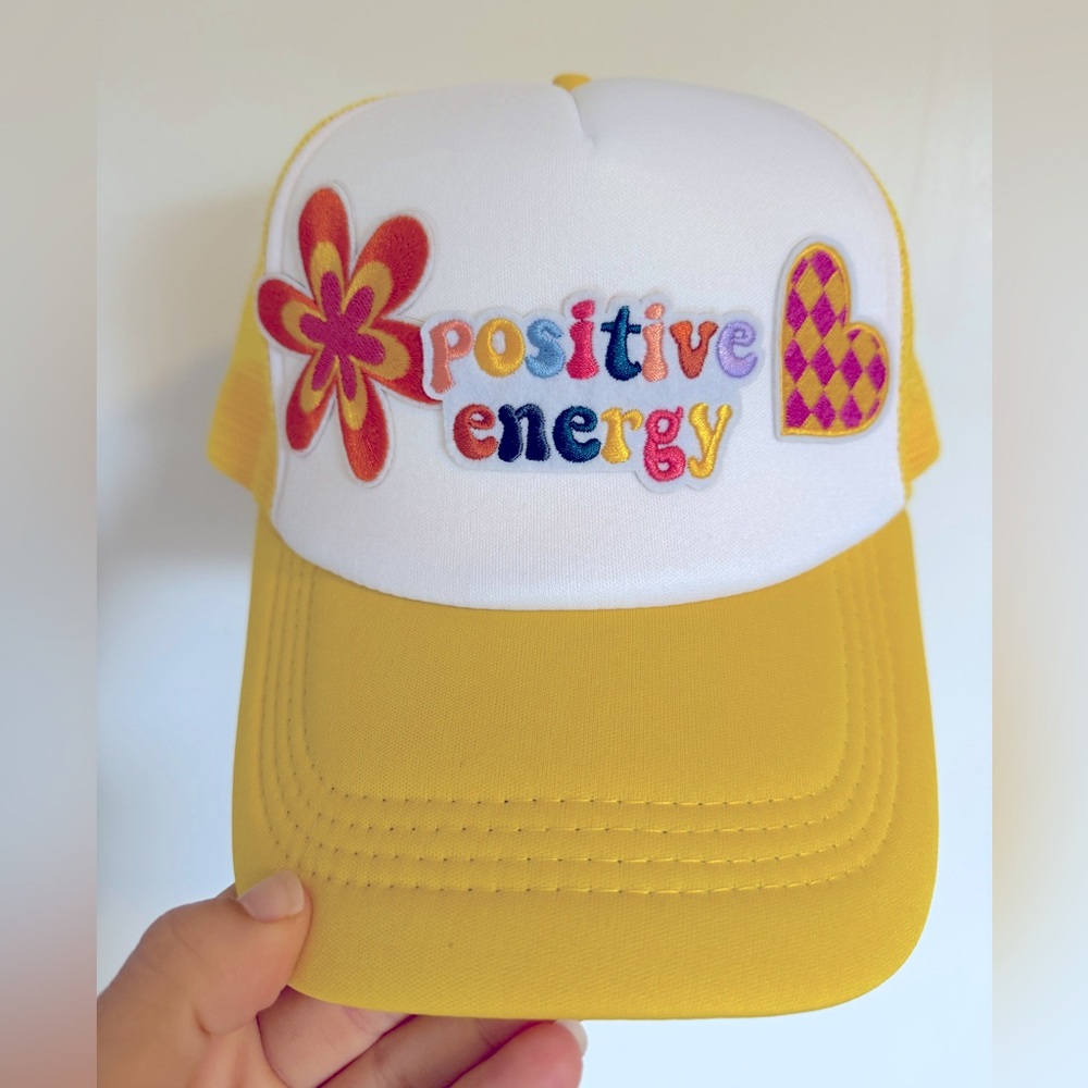 Yellow snapback trucker hat with patches